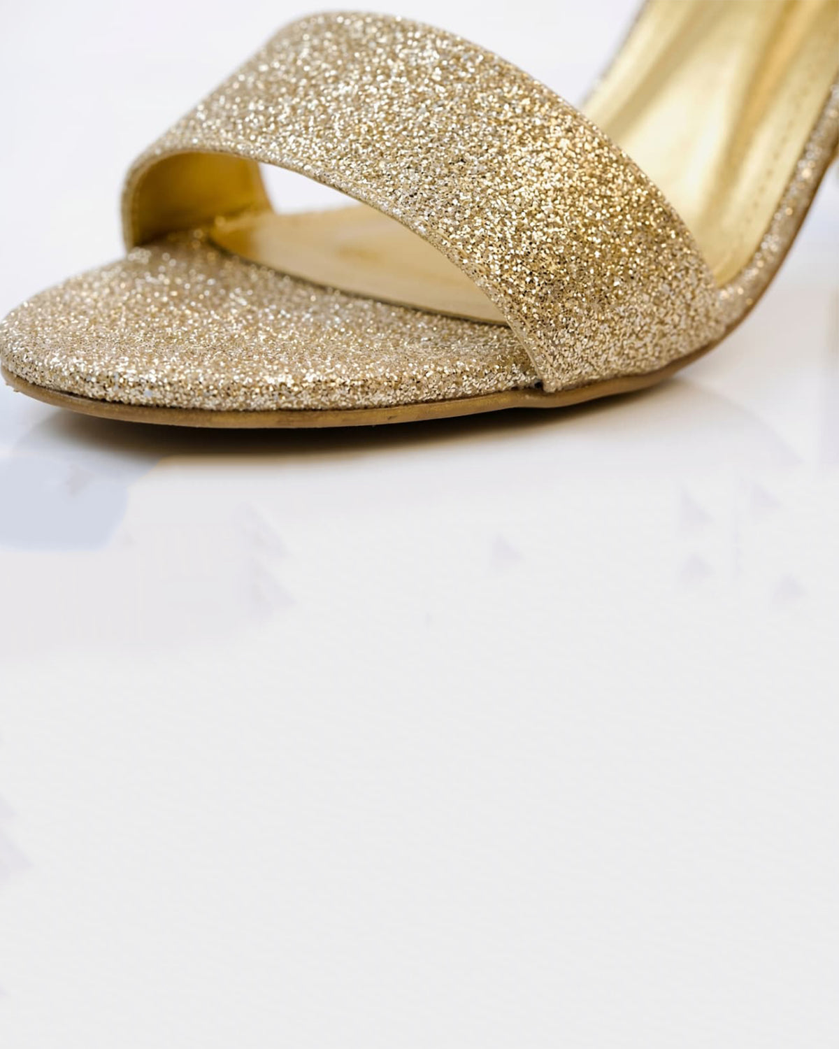 Glitzy golden sandals
