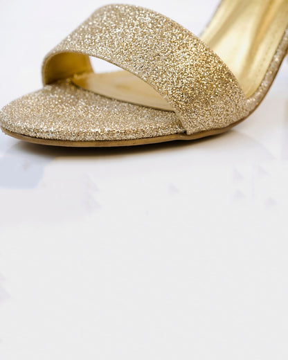 Glitzy golden sandals
