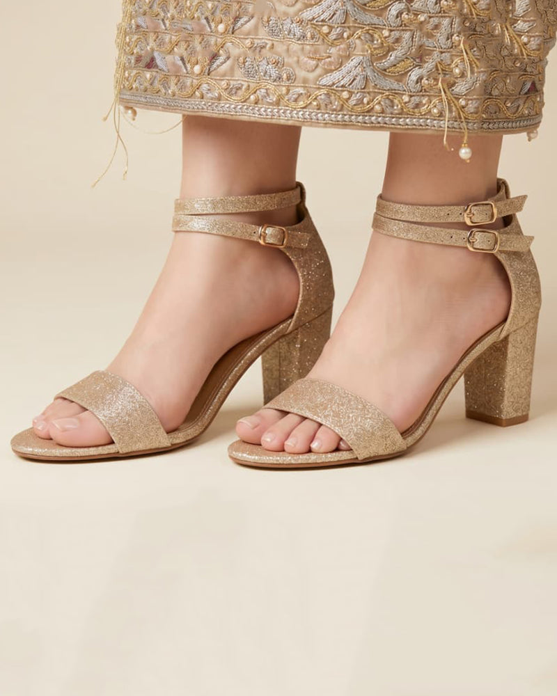 Glitzy golden sandals
